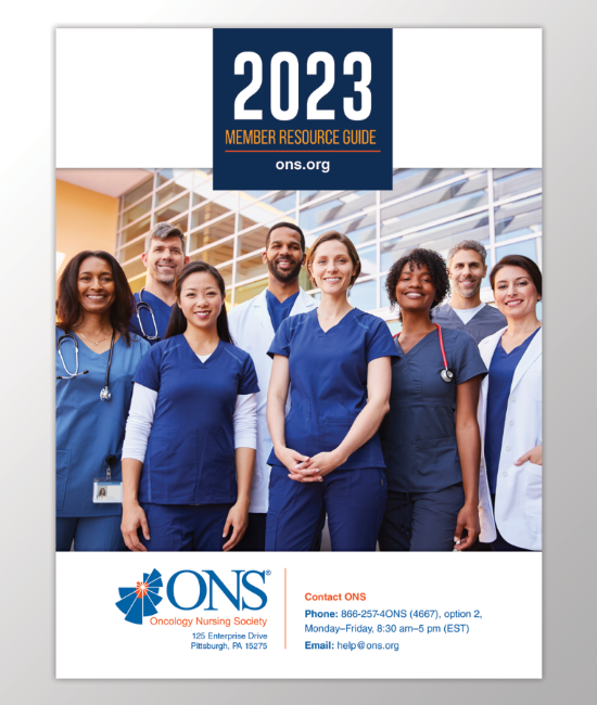 Nurses in navy scrubs, smiling out to viewer; on the cover of Member Resources Guide